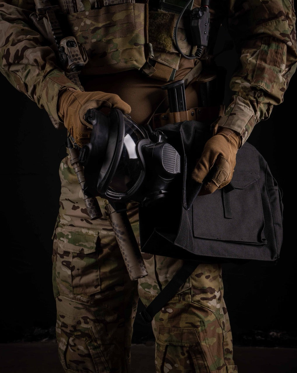 Soldier removing the AirBoss LBM gas mask from it's carrying case.