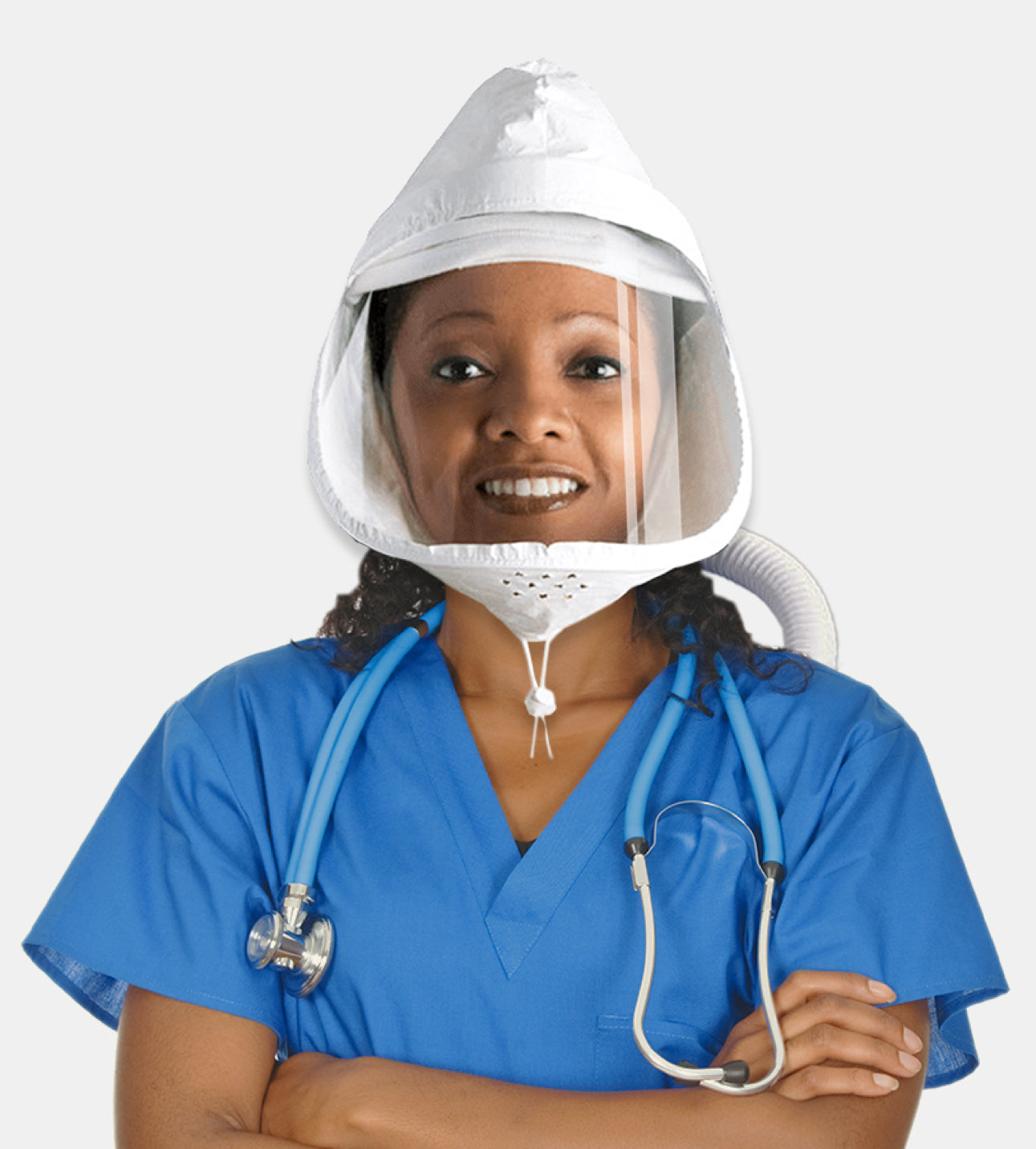 Person wearing a white flexair hood with clear visor and blue scrubs on a white background